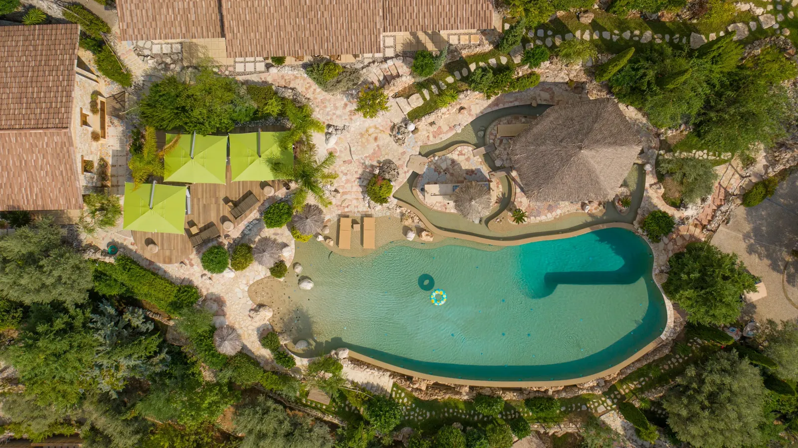 Mimosa from above: the lagoon pool, the villas and the gardens