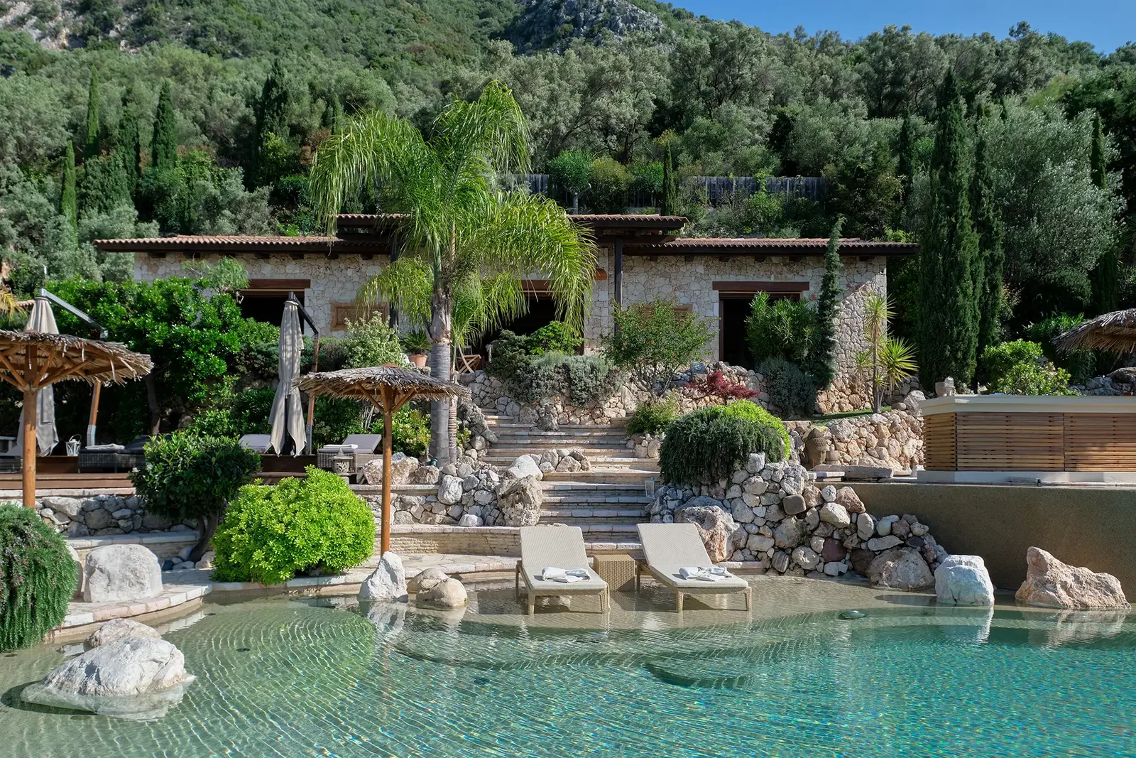 The pool terraces and stone villas among olive trees